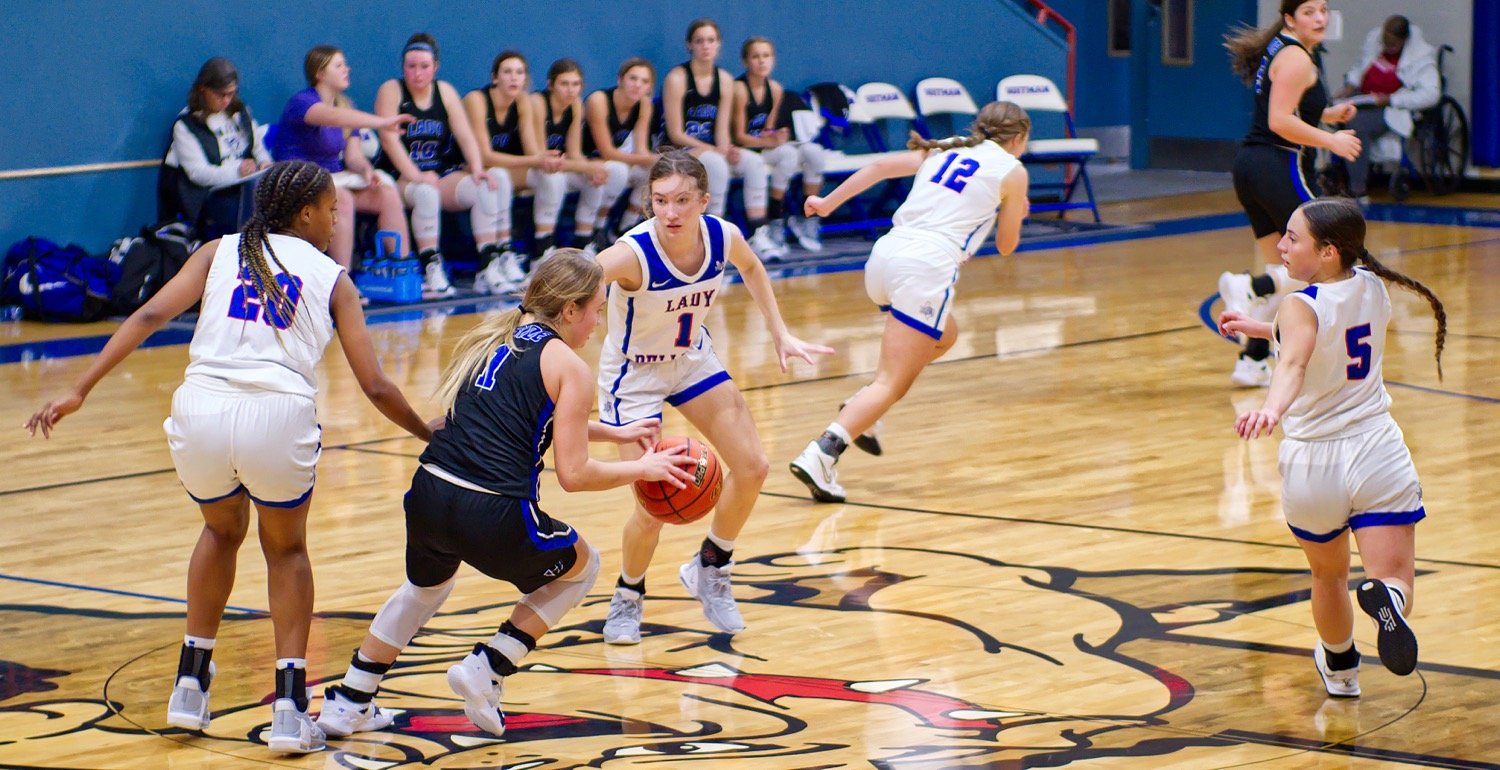 Sophie Reynolds (1) defends midcourt for Quitman along with Allie Berry (20), Larkin Spears (12) and Addison Marcee (5). [see more shots, buy basketball photos]